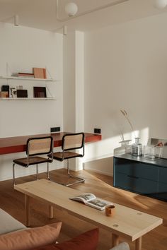 a living room with two chairs and a coffee table