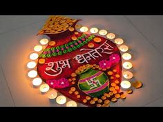 a lighted diya with candles around it