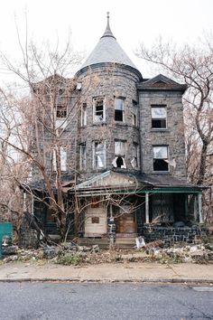 an old run down house with broken windows