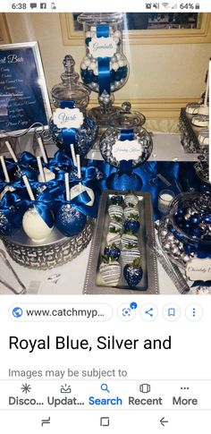 a table topped with lots of blue and white desserts