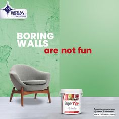 a grey chair next to a green wall with the words boring walls are not fun