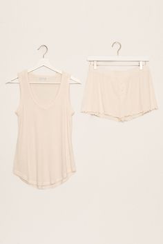 All the soft texture vibes in this 2x2 ribbed sleep set. A soft V-neck tank & mini-button short. Note our "Stone" fabric color is more cream in nature. Ribbed Summer Sleepwear For Lounging, Ribbed Sleepwear For Summer Lounging, Sleeveless Cream Sleepwear For Loungewear, Sleeveless Cream Loungewear Sleepwear, Beige Short Top For Loungewear, Seamless V-neck Sleepwear For Loungewear, Essentials Shorts, Short Note, Sleep Set