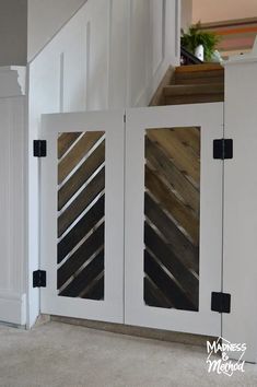 the interior of a house with white painted walls and wooden slats on the doors