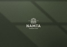 the nammta logo is shown on a dark green background with white letters and shadows