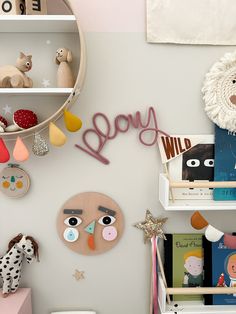 a child's playroom with toys and books