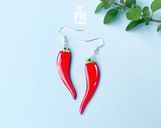 ✨ Funny chili peppers dangle earrings 4.4 x 1.2 cm (1 3/4" x 1/2") - the whole drop length is 6.4 cm (2 1/2") ✨ Crafted from wood with with sterling silver earwires, these quirky earrings are not only stylish but also safe for sensitive ears. ✨ The dangle earrings are covered with liquid glass on one side for protection and an awesome finishing touch. ✨ Processing time: 1-3 business days 🌶️✨ Spice up your style with our funny chili peppers dangle earrings! Crafted to capture the essence of fier Earrings Weird, Surprise Your Girlfriend, Weird Gifts, Quirky Earrings, Gifts For Girlfriend, Small Jewelry Box, 30th Birthday Gifts, Chili Peppers, Weird And Wonderful