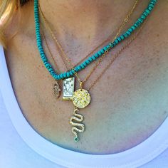 Turquoise is called the self acceptance stone. It promoted self-esteem and unconditional love. Our hand beaded necklace also has a Hamsa charm pendant in goldtone plated brass with cubic zirconia stones. The Hamsa symbol dates back to ancient Mesopotamia where the open right hand is seen in artifacts and in the amulets of the goddess Ishtar. Other symbols of divine protection based around the hand include the Hand-of-Venus which was used to protect women from the evil eye and/or boost fertility, Spiritual Turquoise Charm Necklace For Gift, Turquoise Square Pendant Necklace For Jewelry Making, Turquoise Gemstone Beads Pendant Jewelry, Turquoise Gemstone Rectangular Pendant Jewelry, Handmade Turquoise Necklace With Square Pendant, Turquoise Charm Necklaces For Jewelry Making, Turquoise Pendant Necklace For Healing, Turquoise Charm Necklaces With Round Beads As Gifts, Turquoise Necklaces With Gemstone Beads