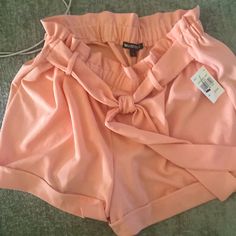 New Light Peach Stretch Shorts. There Is A Belt Built In That You Tie To Look Like A Bow. Casual Peach Bottoms For Summer, Orange Bottoms For Summer Brunch, Casual Peach Bottoms For Spring, Chic Peach Bottoms For Summer, Chic Peach Summer Bottoms, Peach Shorts For Summer, Pink Summer Shorts For Brunch, Fitted Apricot Bottoms For Summer, Casual Peach Short Bottoms