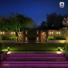 an outdoor area lit up at night with lights on the steps and trees in the background