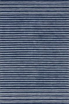 a blue and white rug with horizontal stripes