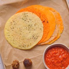 there are four different types of food on the paper bag next to each other, including tortillas and salsa