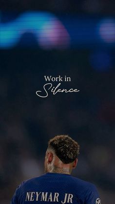 a man in a blue shirt with the words work in science above him and an image of a soccer player