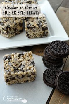 cookies and cream rice krispie treats on a plate with oreos next to it