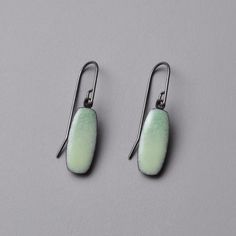 Enamel Earrings - The Alba earrings are mellow steel drop earrings with soft gradations of subtle green enamel. Their rich, colorful surface is created by sifting, layering, and melting powdered glass onto steel. They feature oxidized sterling silver ear wires. Professional Gifts, Artful Home, Organic Form, Enamel Earrings, Green Enamel, Gold Wood, Enamel Jewelry, Oxidized Sterling Silver, Artistic Jewelry