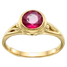 A bright pink, 7 mm round faceted tourmaline rests in a double bezel setting atop a matte-finish split shank design with a delicate spiral motif inside. This ring is currently sized 7.5. It is easily resizable. ...Elegantly simple beauty. Elegant Ruby Ring With Bezel Setting, Formal Ruby Ring With Bezel Setting, Ruby Ring In Yellow Gold With Bezel Setting, Yellow Gold Ruby Ring With Bezel Setting, 14k Gold Ruby Ring With Bezel Setting, Elegant Round Ruby Ring With Bezel Setting, Classic Pink Ruby Ring With Bezel Setting, Ruby Ring With Bezel Setting, 18k Gold Ring