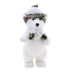 a white polar bear ornament wearing a wreath