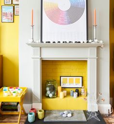 a living room filled with furniture and a fire place in front of a painting on the wall