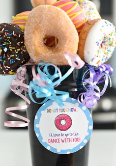 a vase filled with donuts on top of a table