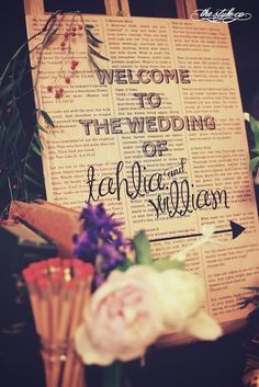 an image of a wedding sign with flowers in front of it and the words welcome to the bride