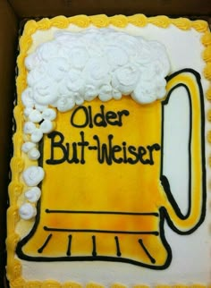 a birthday cake decorated to look like a beer mug with the words older but heier on it