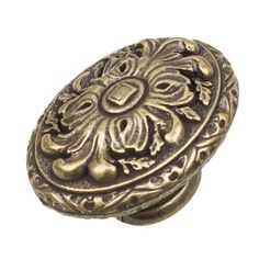 an ornate brass door knob on a white background