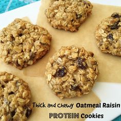 six oatmeal raisin cookies sitting on top of a piece of parchment paper