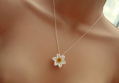 As spring unfurls its delicate petals, so does the allure of the white narcissus daffodil necklace. Picture a pristine flower, its ivory hues and delicate yellow centre capturing the essence of purity and innocence. The white narcissus daffodil symbolizes hope--a beacon of optimism as winter fades and nature reawakens. Its arrival heralds new beginnings, much like the first light of dawn. Imagine gifting this necklace to someone embarking on a fresh chapter--a new job, a milestone, or a personal Daffodil Necklace, White Narcissus, Symbol Of Hope, Hope Symbol, Necklace Pendants, Pretty Hands, Polymer Clay Flowers, Garden Gifts, Flower Necklace