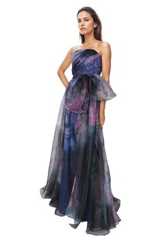 NOW AVAILABLE FOR MADE TO ORDER! 4-6 week delivery time From Rene Ruiz Collection, this strapless hand-draped printed organza A-line gown is a breathtaking masterpiece that seamlessly blends artistry with elegance. Crafted with meticulous attention to detail, this gown features delicate hand draping that creates soft, romantic folds, with an oversized matching belt enhancing the feminine silhouette. STYLE RRCL19137 Built-in bustier Hand draped Strapless Shoulder to hem measurement: 62" Model hei Gown With Belt, Strapless Organza, Organza Gown, Printed Organza, Organza Gowns, Pre Fall Collection, Feminine Silhouette, A Line Gown, Women Helping Women