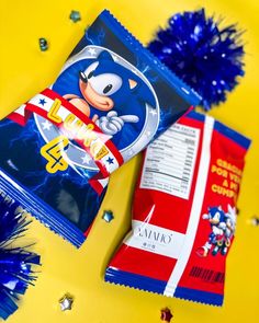 some blue and red items on a yellow table with confetti, streamers and tinsel