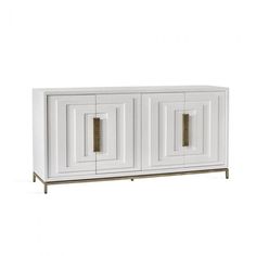 a white cabinet with two doors and gold handles