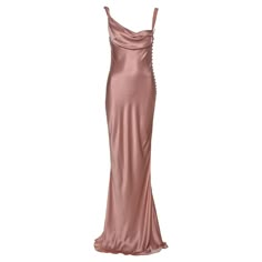 This John Galliano gown in blush pink bias-cut silk features an asymmetric cowl neckline, a twisted shoulder strap on one side, and a grosgrain ribbon strap on the other. The gown's figure-hugging silhouette is accentuated by a side row of Galliano's signature covered buttons and a flared skirt flowing to the floor. ▪ Brand: John Galliano ▪ Creative Director: John Galliano ▪ Collection: Spring-Summer 2007 ▪ Fabric: Silk ▪ Size: FR40 - UK12 - US6 ▪ Made in: France ▪ Condition: Very Good ▪ Mannequ Pink Silk Gown, Galliano Dress, Blush Pink Wedding Dress, Runway Gowns, Blush Gown, Blush Pink Wedding, Pink Wedding Dress, 2020 Style, Formal Fashion