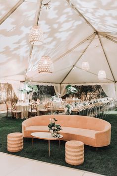 an instagram photo of a couch and tables in a tent