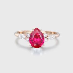 a pink tourmaline and diamond ring on a white background with the top view