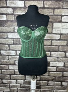 Corset emerald green, sequin corset, sequined corset, sequined bustier, black sequin corset top, party, black, cosplay and clubwear. Adjustable corset with back tie, Good for party, costume, cosplay and clubwear.  We design our products ourselves and produce them in our workshop. We are happy to present it to you. We have stated the size chart in the photos. You can contact us for your size-related questions. Please contact us for your questions and suggestions. Green Strapless Corset Dress For Parties, Green Corset Dress With Sweetheart Neckline For Party, Sequined Corset With Fitted Bodice For Parties, Sequined Fitted Corset For Party, Glamorous Party Corset With Fitted Bodice, Sleeveless Boned Bodice Corset For Party Season, Glamorous Sequined Corset For Party Season, Sequined Corset For Party Season, Glamorous Sequined Corset With Sweetheart Neckline