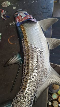 the fish is made out of metal parts