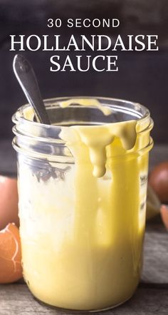 a jar filled with hollandaise sauce next to eggs