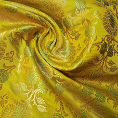 a yellow and green brocaded fabric