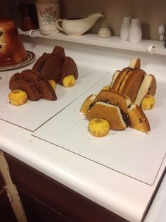 two slices of banana bread are laying on the kitchen counter, one is cut in half to look like a car