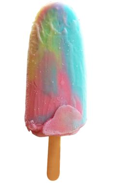 a colorful popsicle is sitting on a white surface