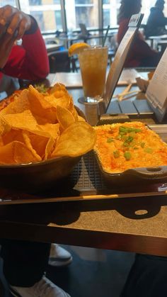 two pans filled with food sitting on top of a counter next to each other