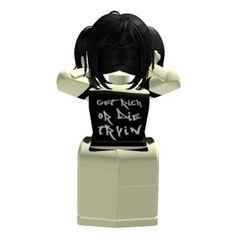 a lego figure that is wearing a shirt with writing on it