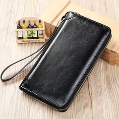 Introducing the ChicLeather Zipper Long Wallet, a stylish and durable accessory crafted with the finest genuine cow leather. With its ample space and luxurious solid pattern design, this wallet is the perfect blend of fashion and functionality. Upgrade your accessory game and experience the epitome of fashion and durability with the ChicLeather Zipper Long Wallet today. Black Leather Wallets With Zipper Closure, Black Leather Wallet With Zipper Pocket, Brown Coffee, Genuine Leather Belt, Leather Belts, Long Wallet, Solid Pattern, Travel Backpack, Signature Style