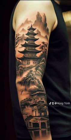 a man with a tattoo on his arm that is covered in clouds and pagodas