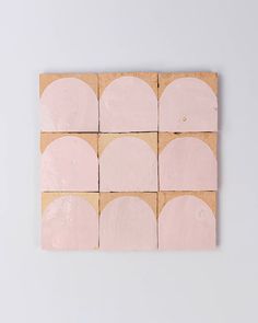 four square tiles with pink and beige circles arranged on top of each other in squares