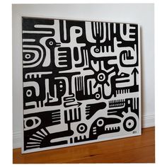 a large black and white painting on the wall