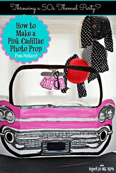 a pink car with polka dots on it and a red heart hanging from the front