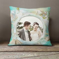 a decorative pillow with an image of a bride and groom in the frame on it