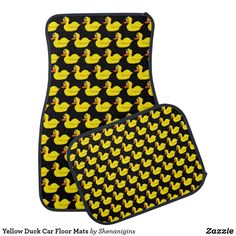 two yellow ducks on black car mats