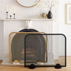 a fireplace with a mirror and vases on the mantel next to it in front of a white brick wall