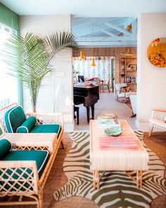 a living room filled with furniture and a piano